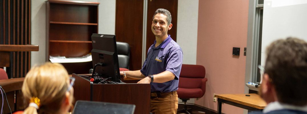 Corey Pulido teaching a business class at East Carolina University