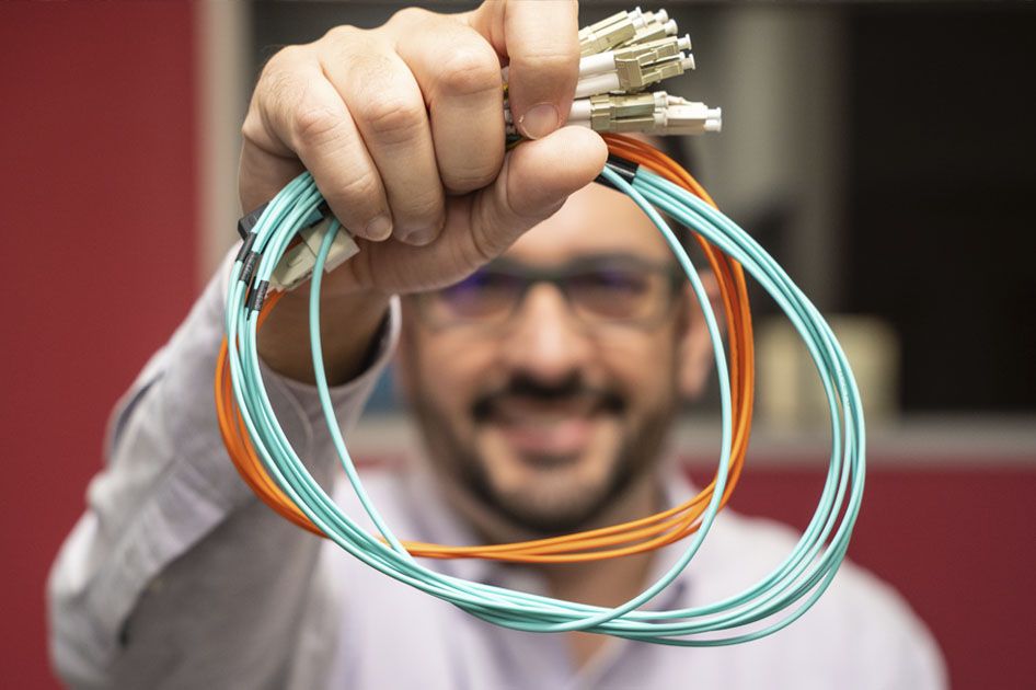 FletNet founder Mauricio Rodriguez holding fiber optic cables