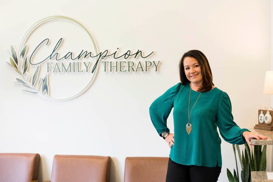 Jessica Champion posing in the office of Champion Family Therapy