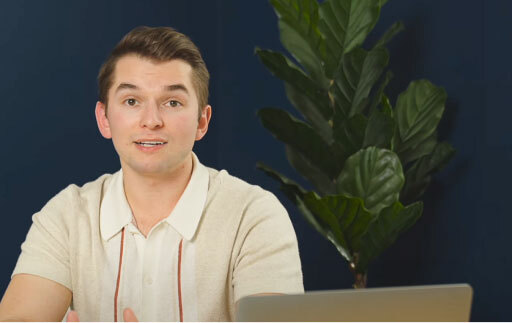 Man talking with laptop in front of him