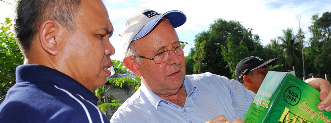 MicroAid Managing Director Richard Beresford talking to an Indonesian farmer