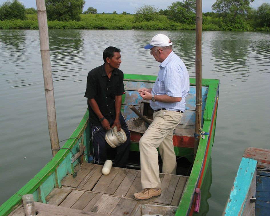 MicroAid Managing Director Richard Beresford talking to an Indonesian worker