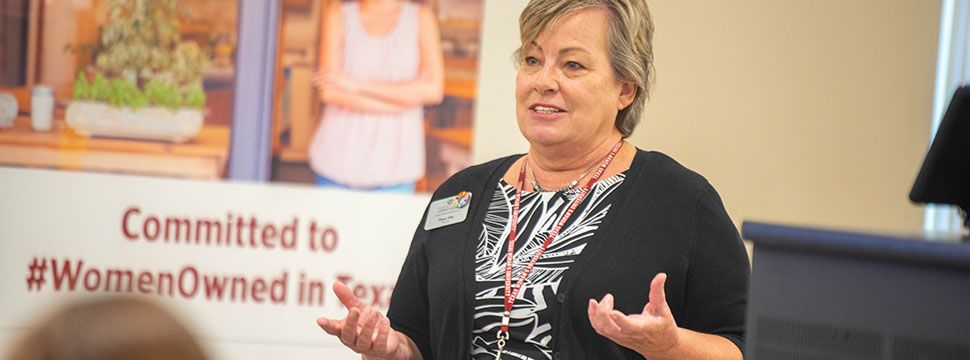 Tracy Irby giving a presentation at Texas Woman's University