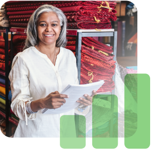 Woman in fabric store with stack of papers in hand